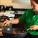 Experienced home cook preparing fresh and hygienic food in kitchen